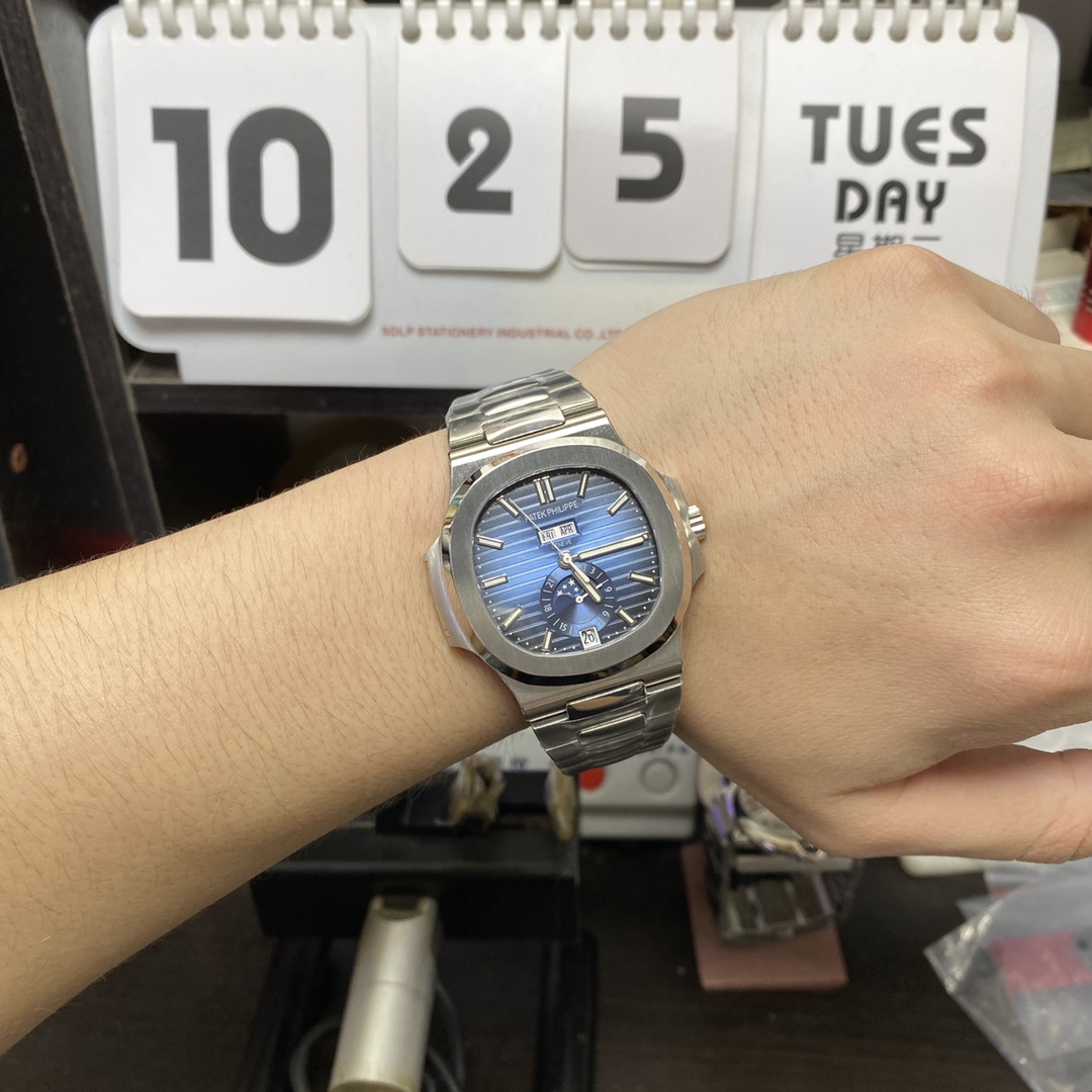 Patek Philippe Nautilus series 57261A-014, Blue Dial Steel Bracelet, Moon Phase Calendar Central Month and Week Display, 40.5mm Size.