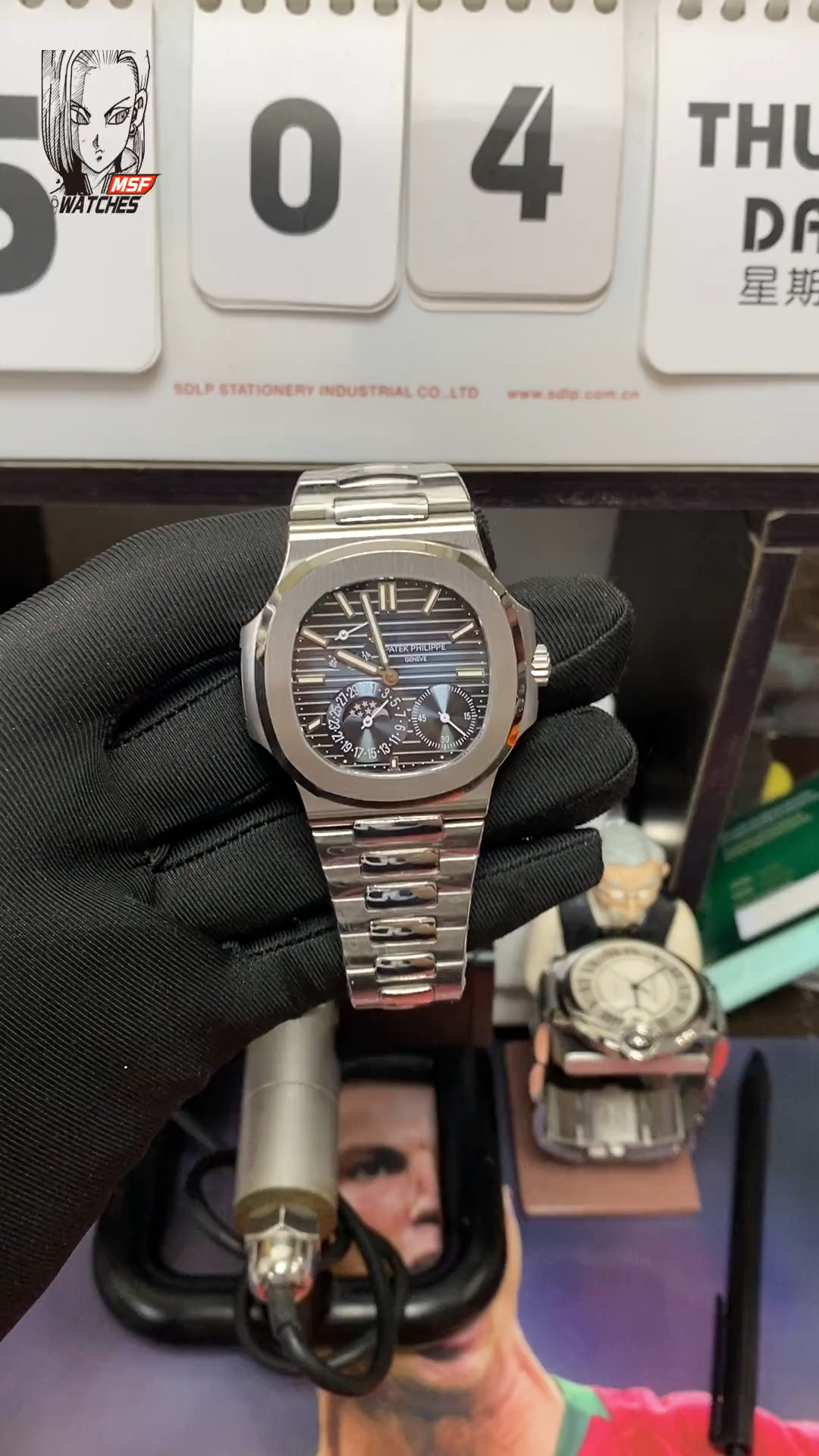Patek Philippe Nautilus series 57121A-001, Blue Dial Steel Bracelet, Synchronized Functions, 40mm size.