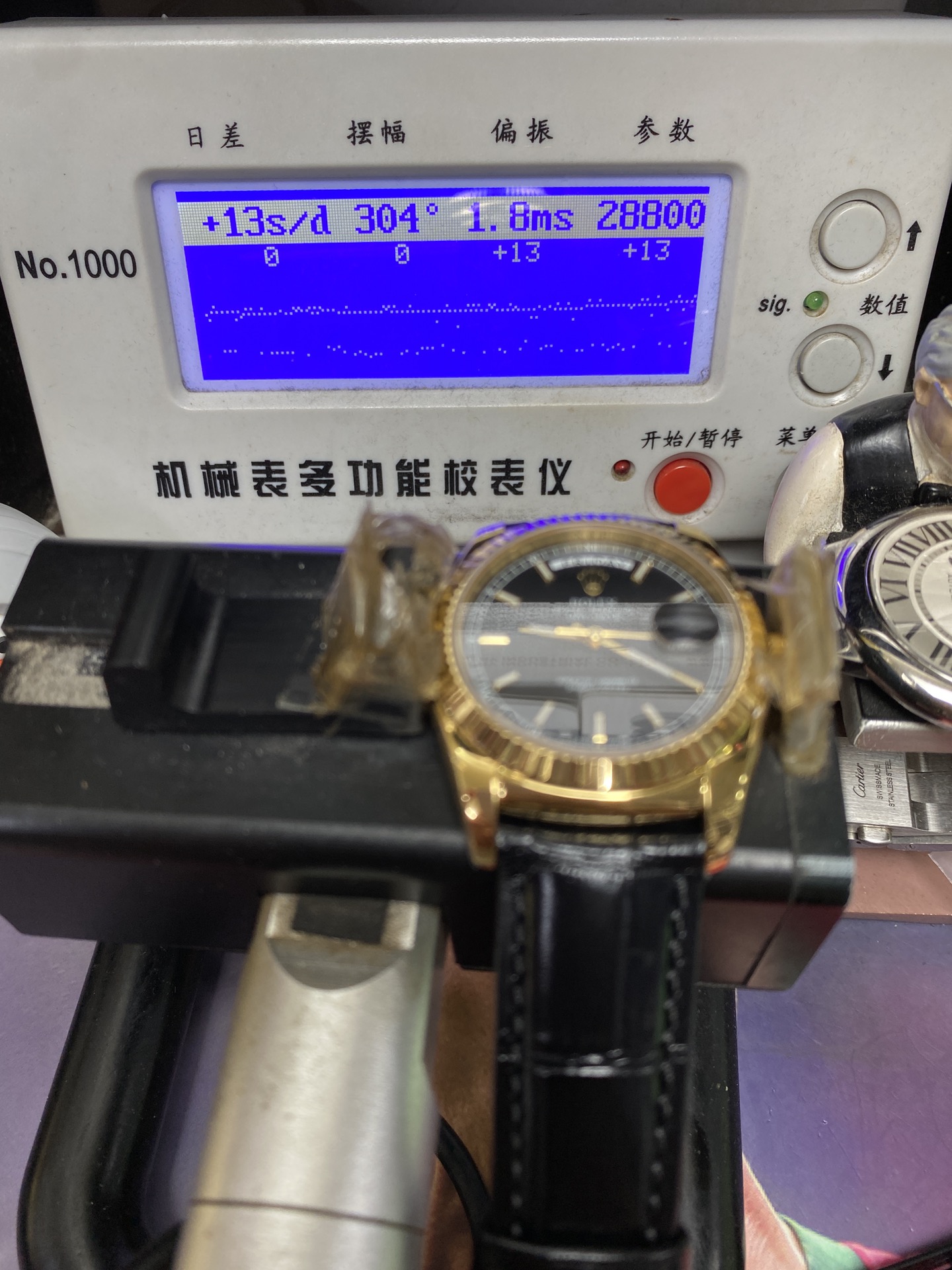 Rolex Day-Date Series 118135, Black Dial Gold Case with a leather strap, 36mm size.